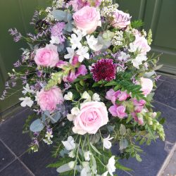 Pink and white coffin spray.