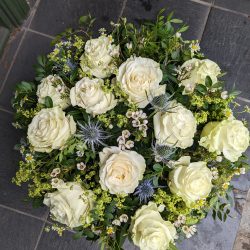 Funeral tribute of white roses by Just So Flowers