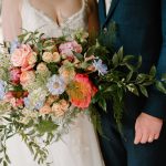 Bride holding her wedding bouquet by Just So Flowers