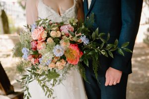 Bride holding her wedding bouquet by Just So Flowers