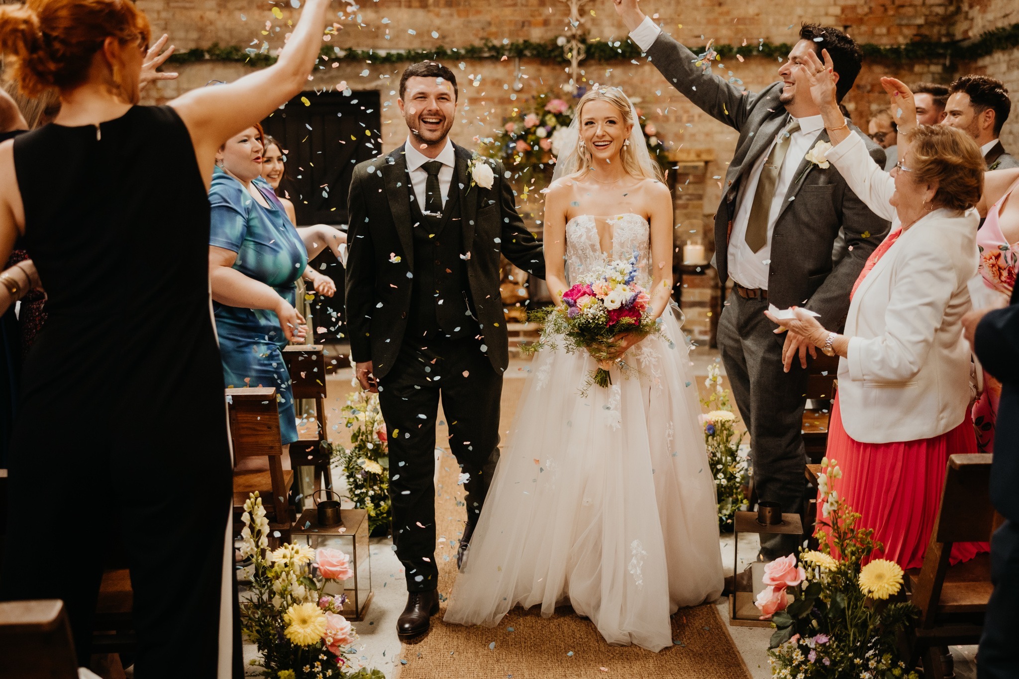 Bride and groom at Botley HIll Barn with Flowers by Just So Flowers
