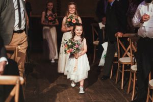 Bridesmaids at Wilton's Music Hall with Flowers by Just So Flowers