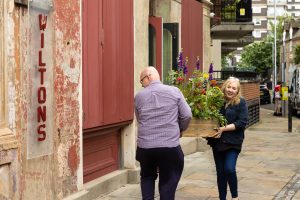 Just So Flowers delivering flowers to Wilton's Music Hall.