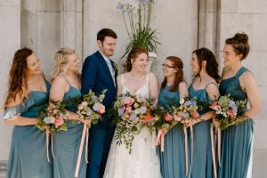 Alana and Tom with bridesmaids and Flowers by Just So Flowers