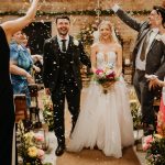Bride and Groom at the Barn at Botley Hill with Flowers by Just So Flowers