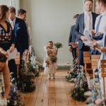 Little flower girls walking down the aisle at Beckenham Place Mansion with Flowers by Just So Flowers