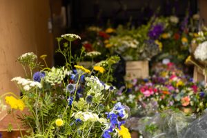 Van loaded with flowers for a wedding by Just So Flowers