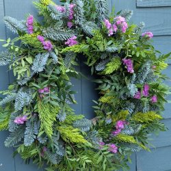 A pink Christmas wreath by Just So Flowers