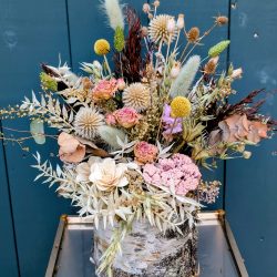 Contemporary dried flower arrangement made Just So Flowers.