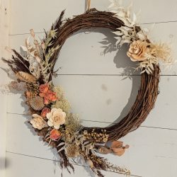 A 'half-moon' dried flower wreath by Just So Flowers